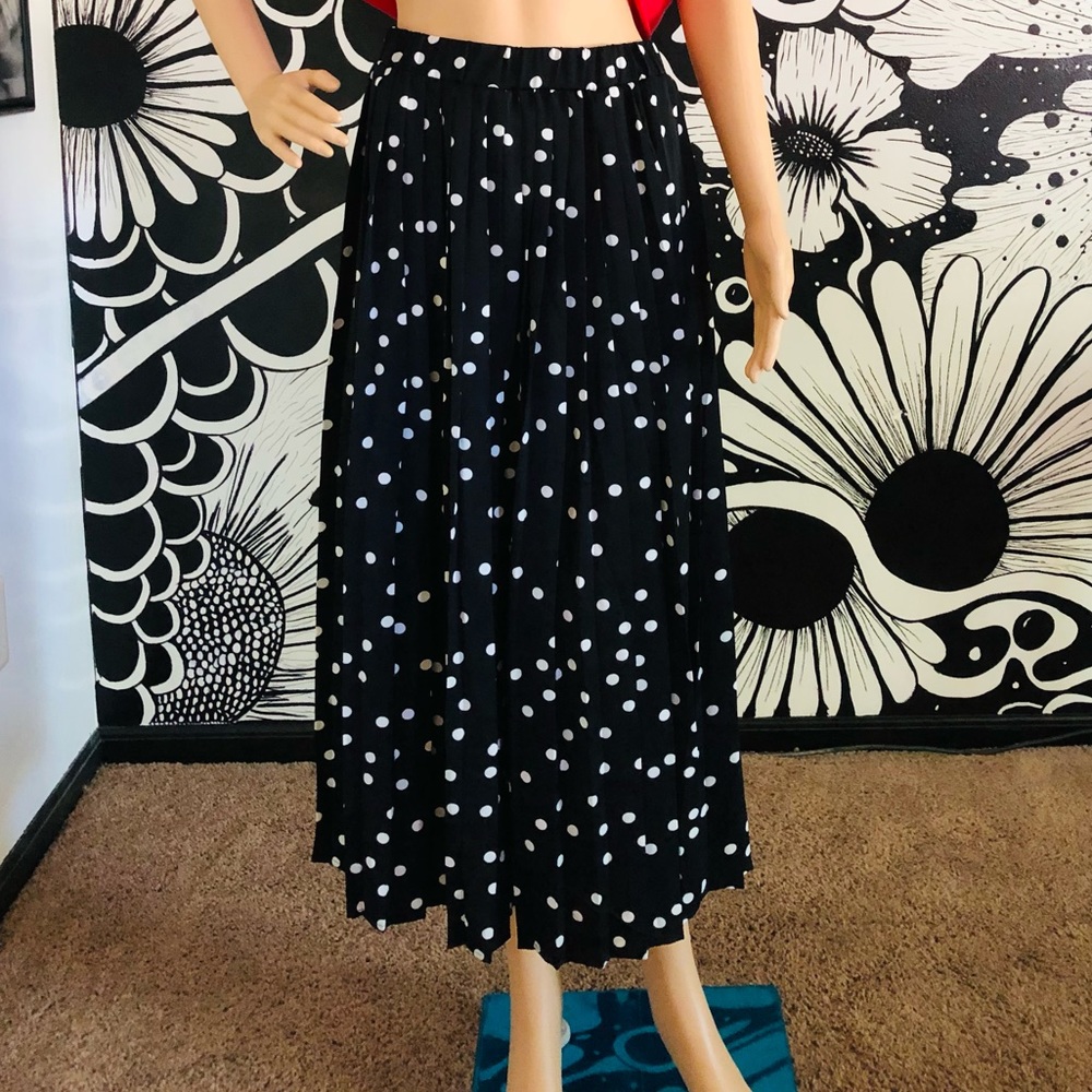 Black and white polka dot skirt.